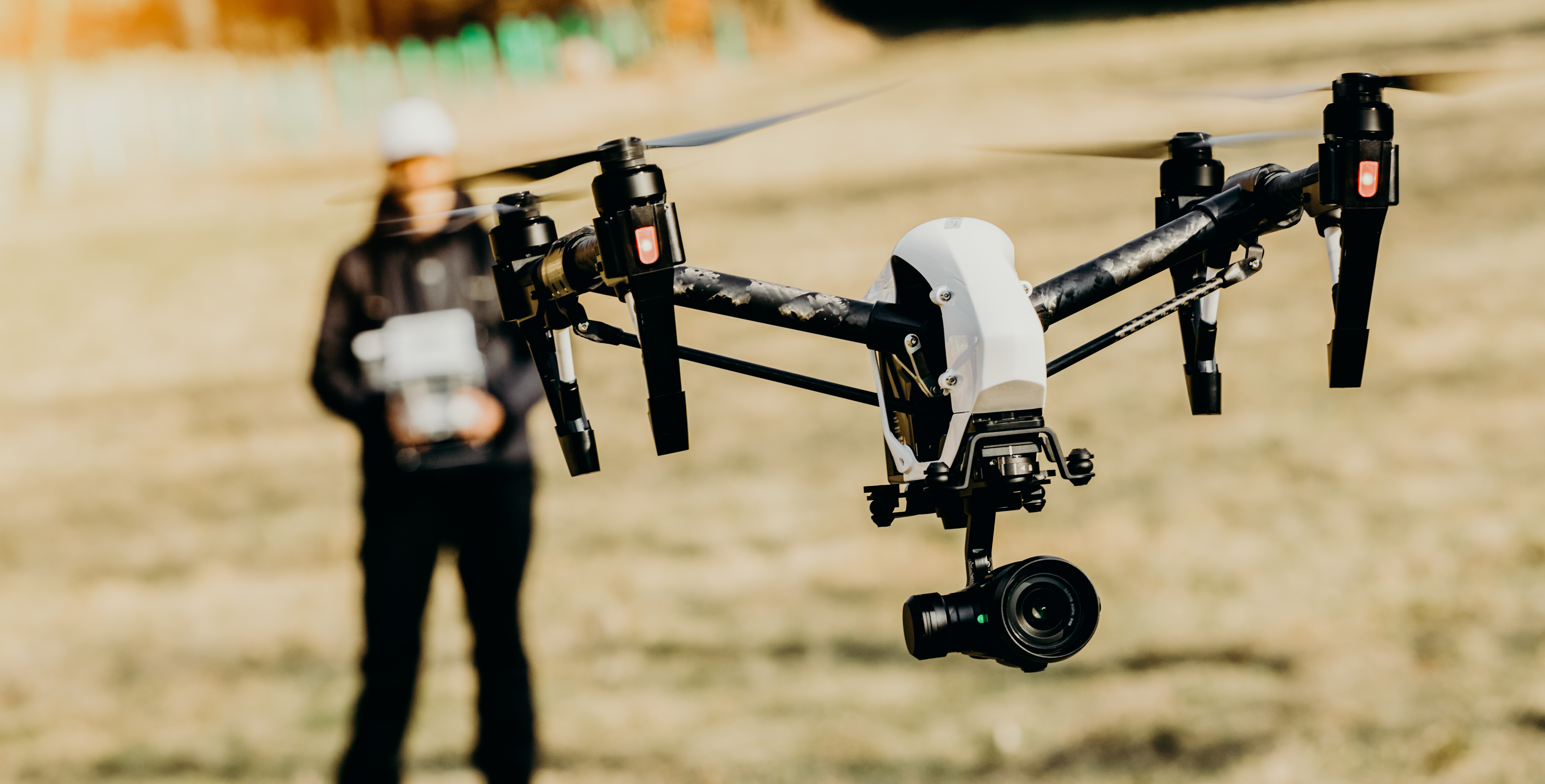 Man handling drone in nature Man handling drone in nature, focused on drone