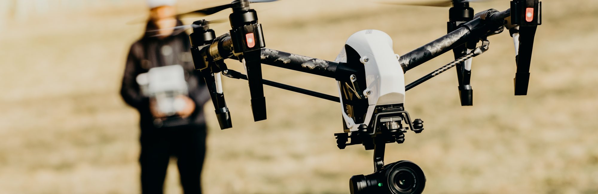 Man handling drone in nature Man handling drone in nature, focused on drone